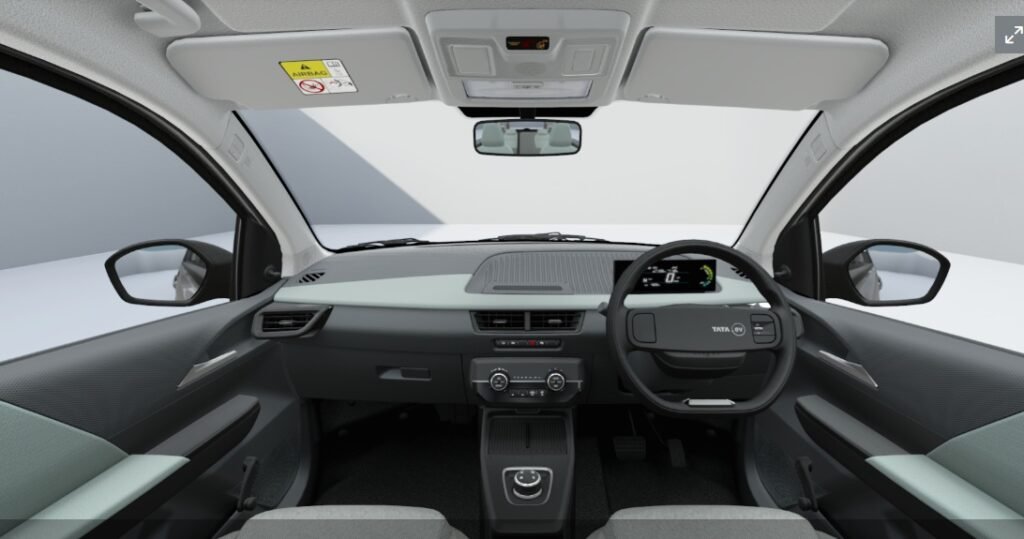 Premium dashboard layout inside the 2026 Tata Tiago EV showcasing the new 10.25 inch touchscreen console.